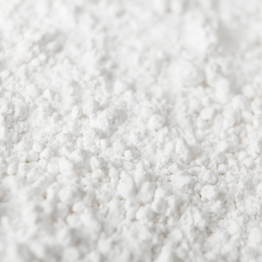 Close up image of the white powder of Texture Dust