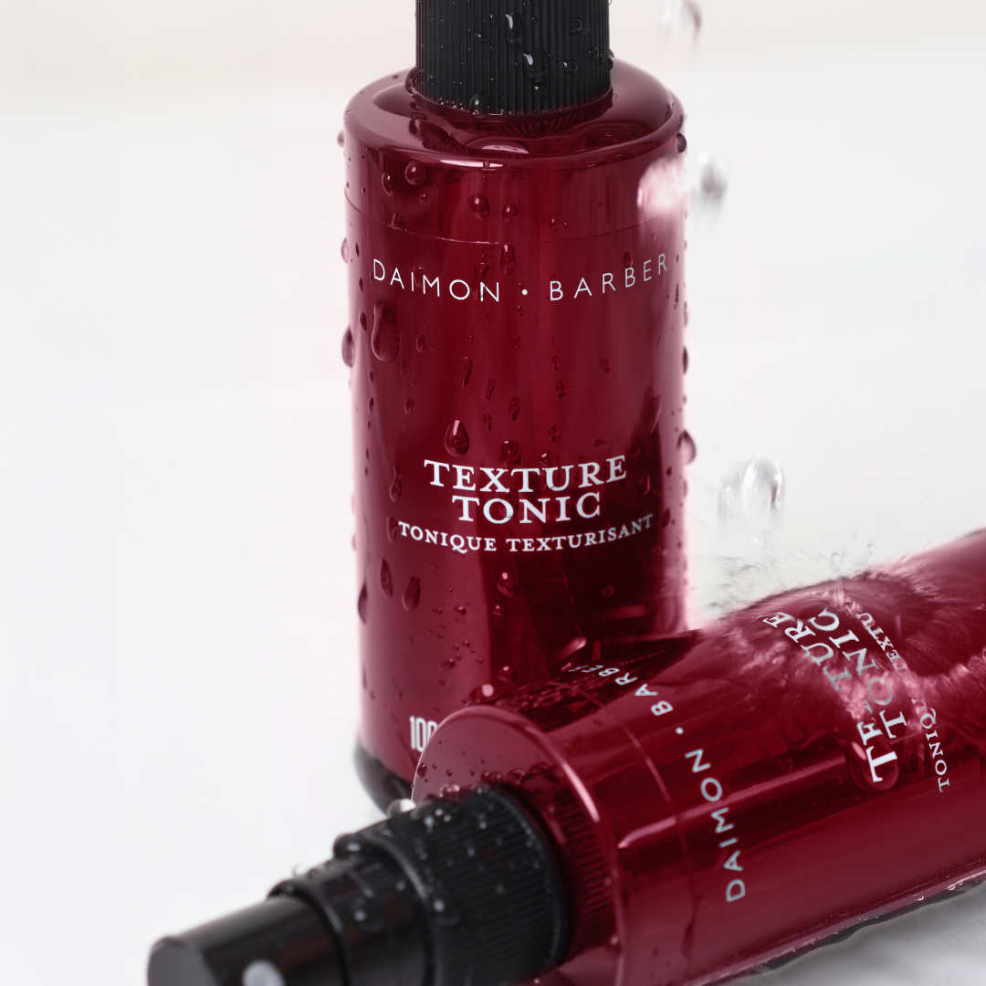Two Texture Tonic Bottles with water running down on white background