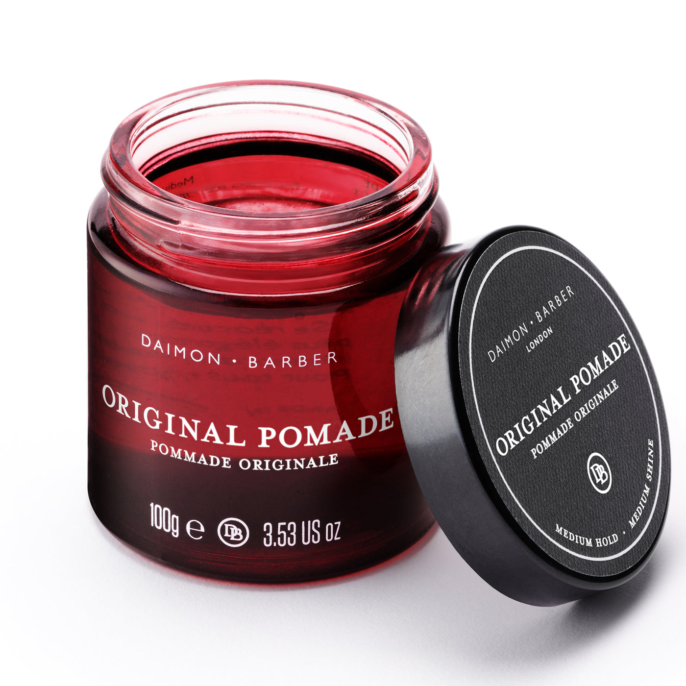 Opened jar of Original Pomade on white background